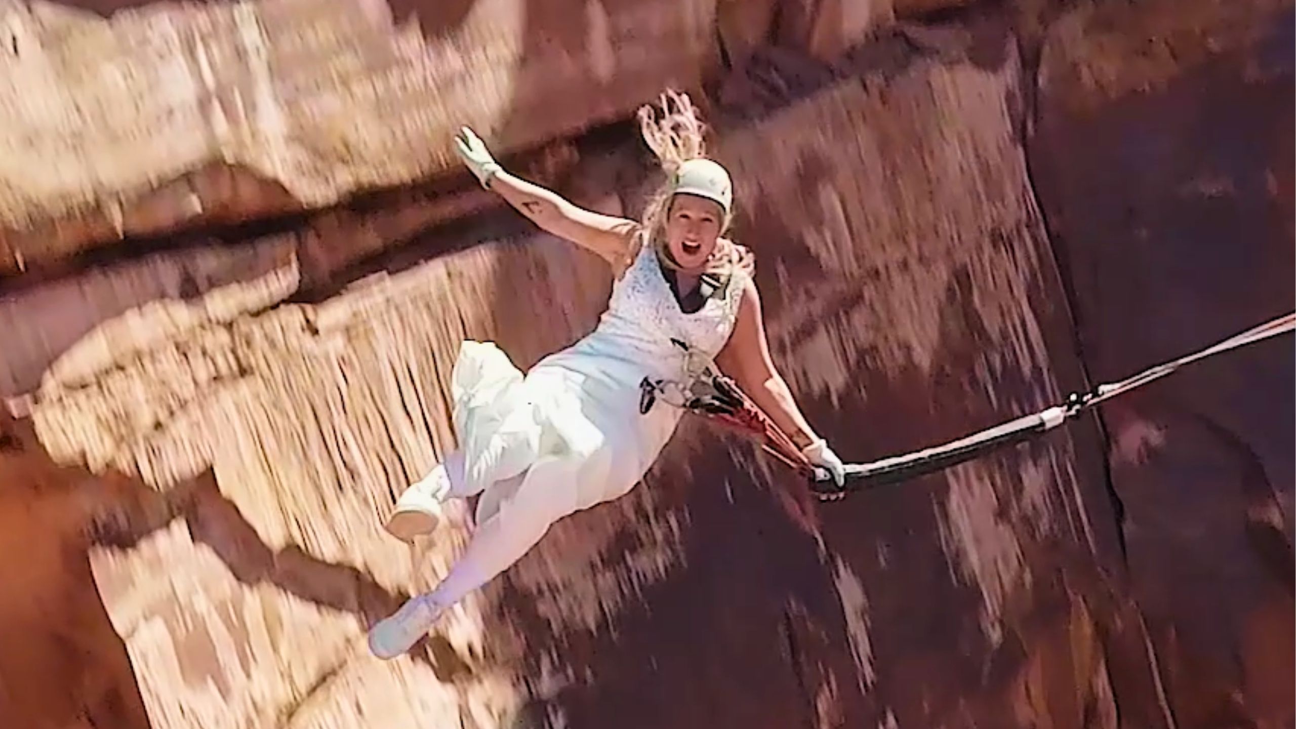 Bride And Groom Rope Swing Off Cliff Taking Plunge Into Married Life